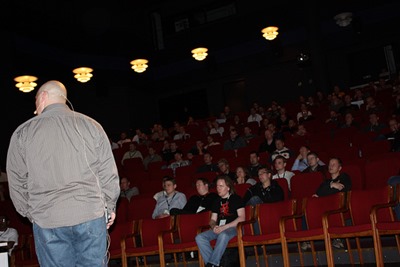 Josh Holmes with audience in the background